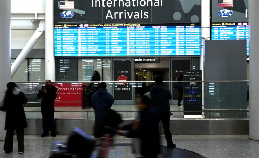 Passengers arrive at Pearson International Airport in Toronto on Wednesday, Feb.11, 2026.