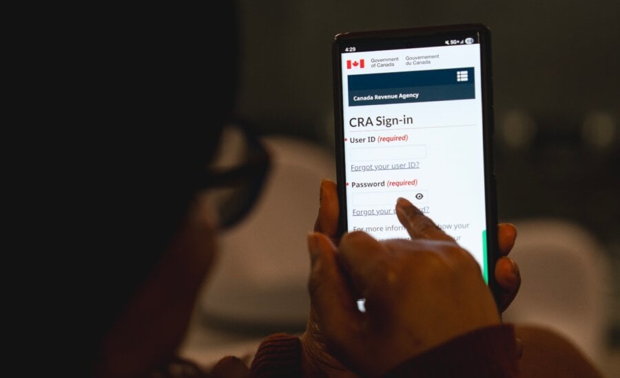 It's worth looking at the list of tax benefits that may apply to you, both federally and by province or territory. A person looks at the Canada Revenue Agency MyCRA login screen in a photo illustration in Toronto, Saturday, Feb. 28, 2026.