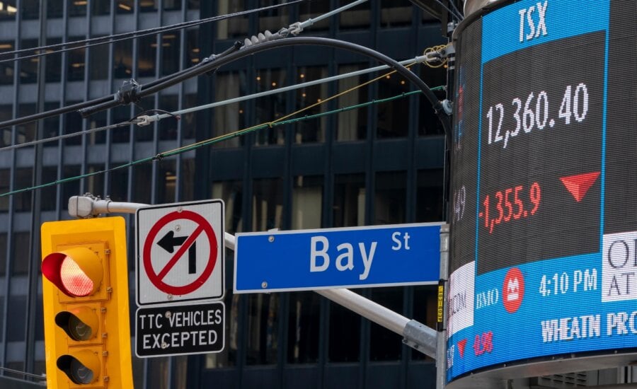A sign board in Toronto displays the TSX close on Monday March 16, 2020.