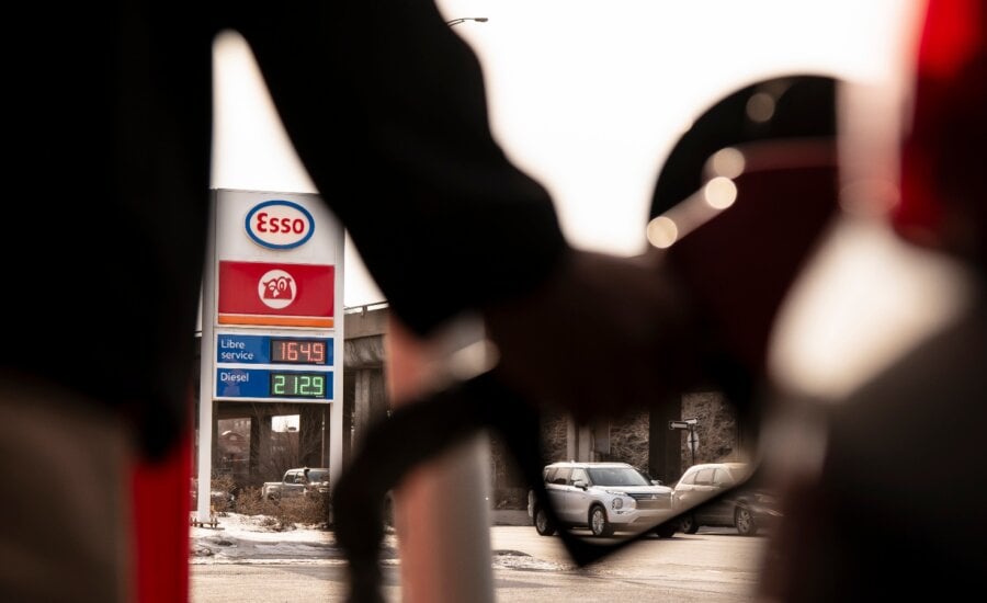 Fuel prices are displayed as a person fills up their car with gas at a station in Montreal on Thursday, March 5, 2026.