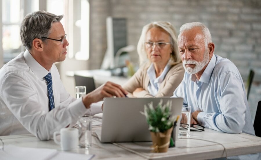 Senior couple meeting with their financial planner