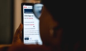 A person looks at the Canada Revenue Agency MyCRA login screen in a photo illustration in Toronto, Saturday, Feb. 28, 2026. THE CANADIAN PRESS/Giordano CiampiniA person looks at the Canada Revenue Agency MyCRA login screen in a photo illustration in Toronto, Saturday, Feb. 28, 2026.