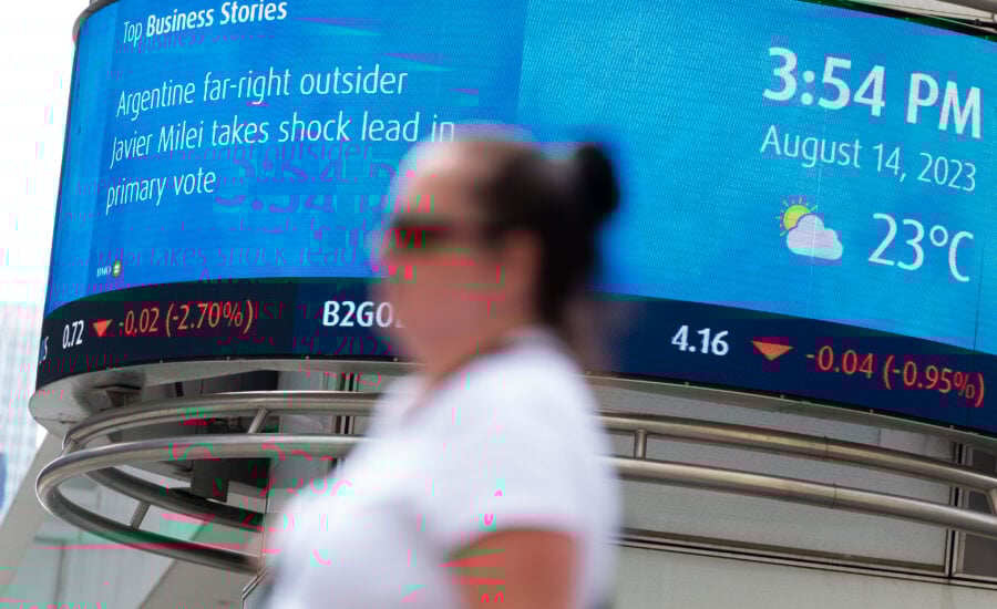 A Bank of Montreal (BMO) electronic ticker showing the stock prices of certain commodities is seen in the Financial District of Toronto, Aug. 14, 2023.