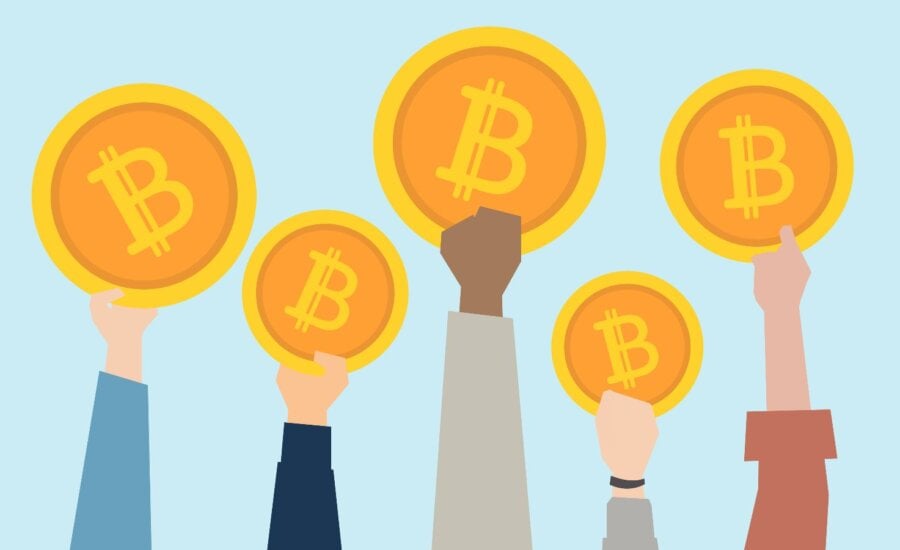 People holding up cryptocurrency coins