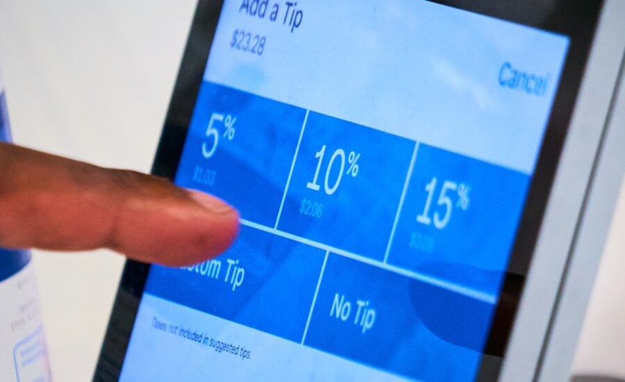 Customers are presented with a tip option screen at a restaurant in Toronto, on Wednesday, Aug. 20, 2025.