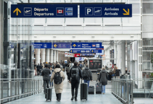 Travellers walking at Montreal-Pierre Elliott Trudeau International Airport
