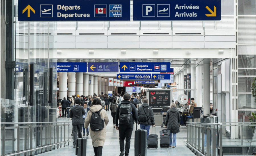 Travellers walking at Montreal-Pierre Elliott Trudeau International Airport