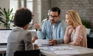 Young couple speaking to a financial advisor