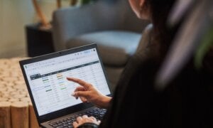 A person works on a spreadsheet in a photo illustration made in Toronto, on Monday, Sept. 22, 2025.