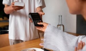 Person using a payment terminal at a restaurant