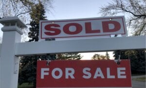 Sold sign in front of a house