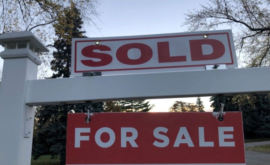 Sold sign in front of a house