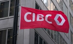 The new CIBC logo displayed on a flag in front of its headquarters in Toronto on Monday, Oct. 25, 2021.