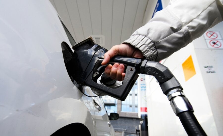 A woman pumps gas at a gas station in Mississauga, Ont., on Feb. 13, 2024.