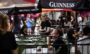 A server works on the patio of a pub in the ByWard Market in Ottawa, on Friday, June 23, 2023.
