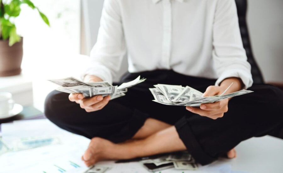 Person holding a lot of cash