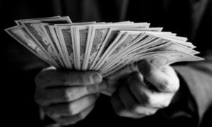 Closeup of hands holding a lot of cash