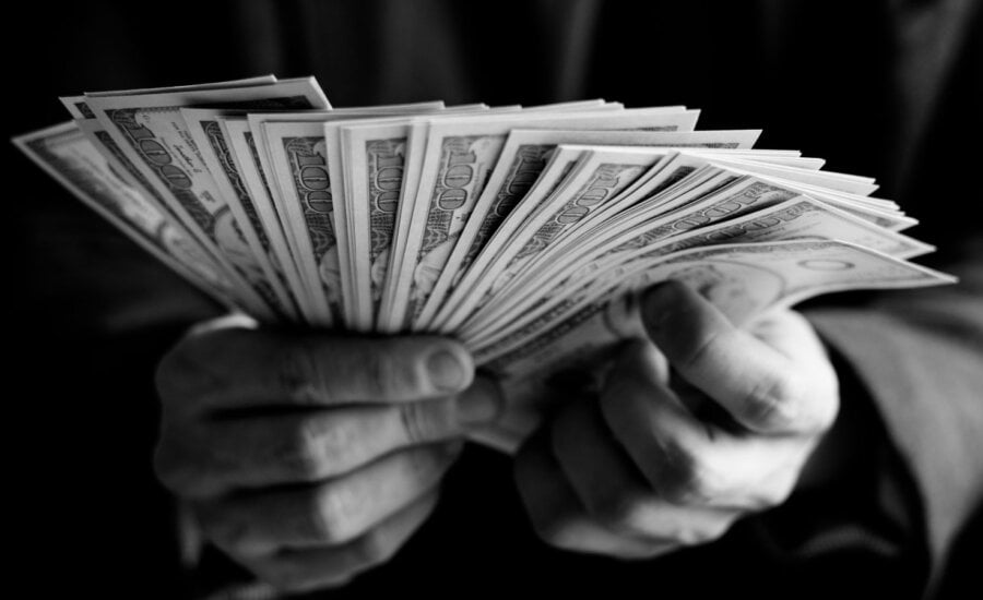 Closeup of hands holding a lot of cash