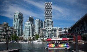 An Aquabus water taxi carrying tourists prepares to dock at Granville Island in Vancouver, B.C., Friday, Aug. 1, 2025.