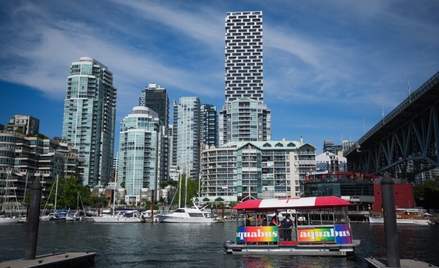 An Aquabus water taxi carrying tourists prepares to dock at Granville Island in Vancouver, B.C., Friday, Aug. 1, 2025.