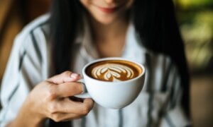 Portrait asian woman smiling relax in coffee shop cafe