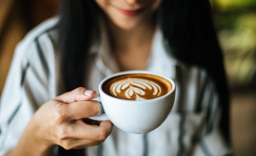 Portrait asian woman smiling relax in coffee shop cafe