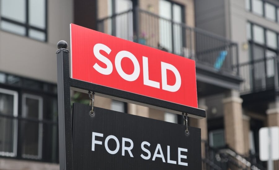 A for sale/sold sign stands in front of residential homes in the Riverside South neighbourhood of Ottawa on Friday, Aug. 30, 2024.