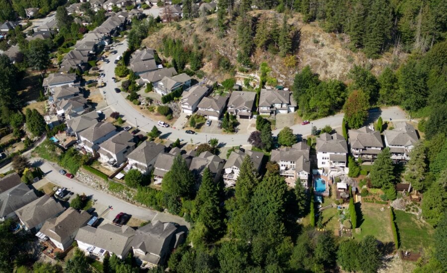 Houses are seen in a neighbourhood on the side of a mountain, in Maple Ridge, B.C., on Thursday, Aug. 17, 2023.