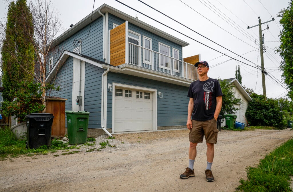 Calgary resident Eugene Blanchard, who built a laneway home for his daughter and son-in-law, shows off the home in Calgary, Tuesday, July 14, 2026. 