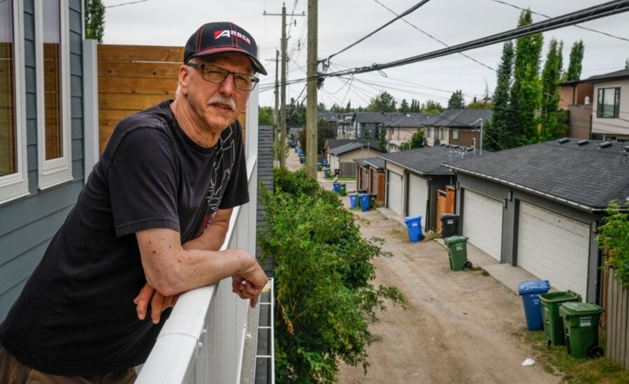 Calgary resident Eugene Blanchard, who built a laneway home for his daughter and son-in-law, shows off the home in Calgary, Tuesday,