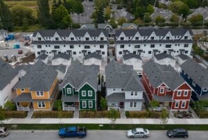 New single family houses billed as estate cottages and townhouses under construction are seen in an aerial view, in Delta, B.C., on Monday, Aug. 12, 2024.