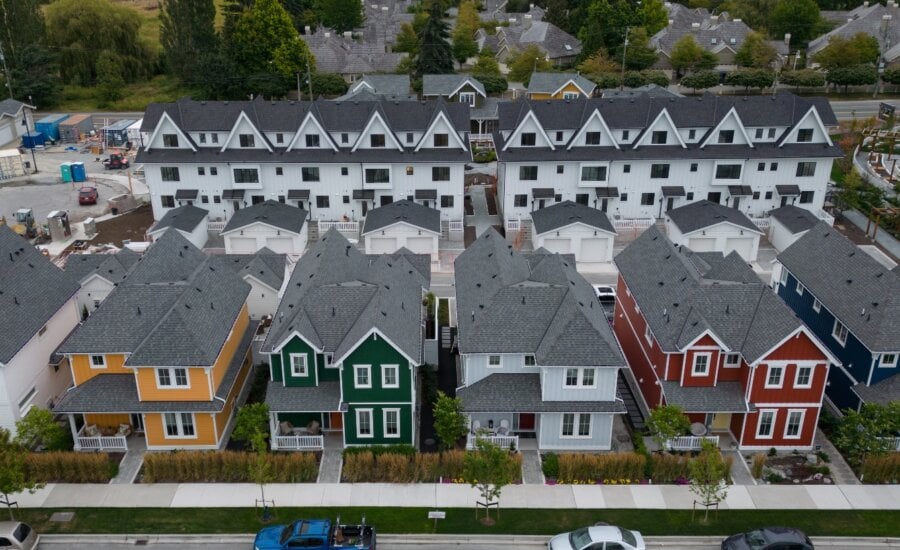 New single family houses billed as estate cottages and townhouses under construction are seen in an aerial view, in Delta, B.C., on Monday, Aug. 12, 2024.