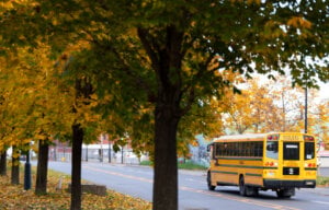 A school bus drives down a street in Montreal, Thursday, Oct. 24, 2024.