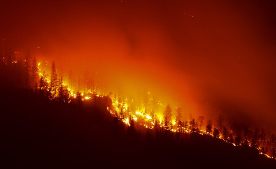 The Quilpituk Creek wildfire burns on the west side of Okanagan Lake near Fintry, B.C., late Monday, Aug. 3, 2026.