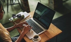 Woman sitting at a desk on a laptop