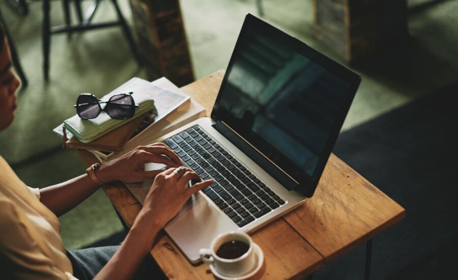 Woman sitting at a desk on a laptop