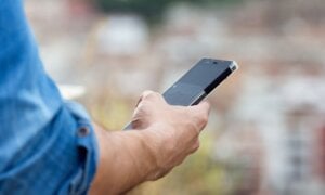 Man holding cell phone in his hand