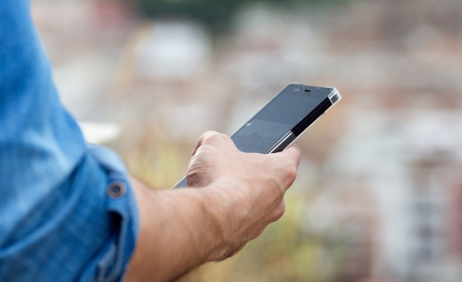 Man holding cell phone in his hand