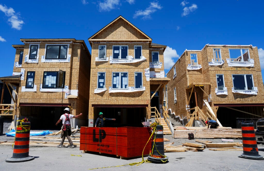 Carpenters build new homes in Ottawa on Monday, June 1, 2026.