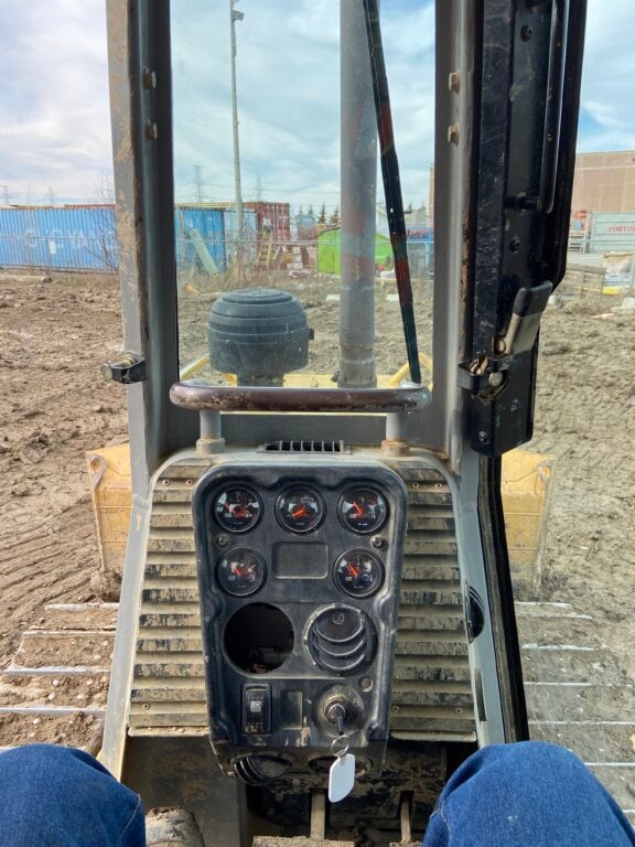 Simon Hardcastle, 49, left his desk job to become a heavy equipment operator. A view from his new job is shown in this undated handout photo.